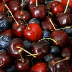 Vibrant mix of cherries, blueberries, and strawberries in a close-up shot.